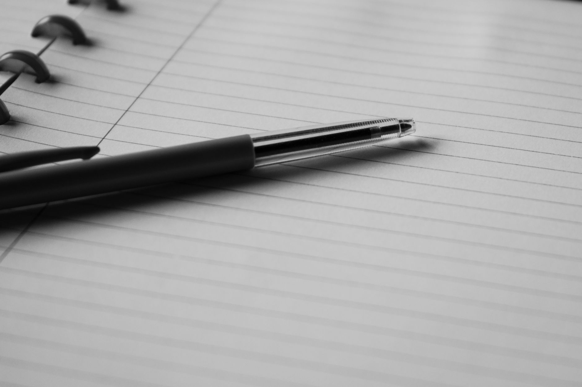 Notebook with lined paper and a pen.