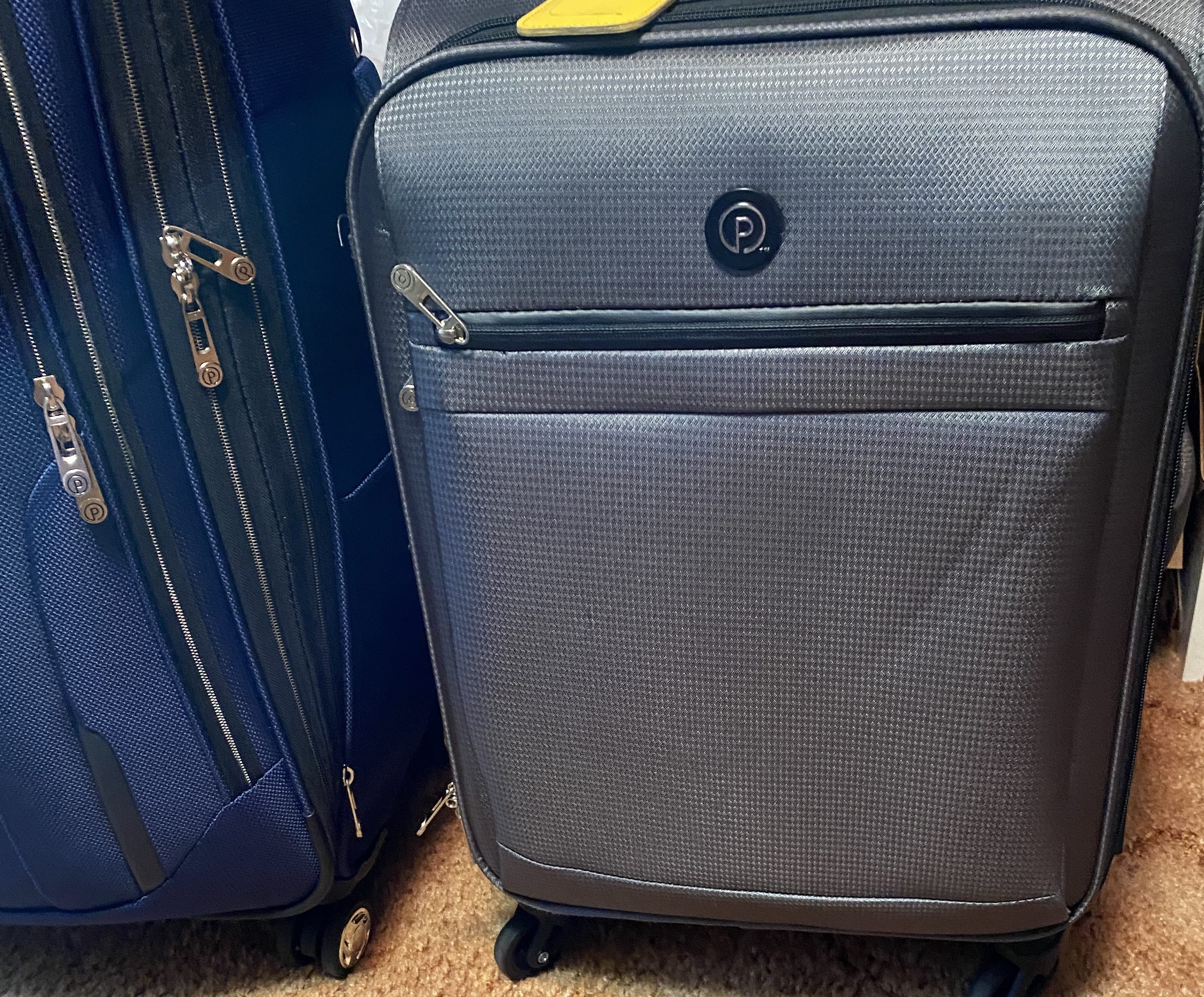 Two wheeled suitcases. Luggage.